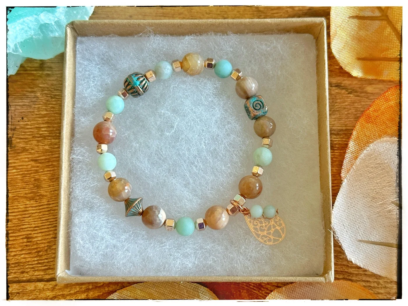 Multicolored beaded bracelet with a heart charm
